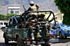 Les forces armées houthies du Yémen patrouillant, samedi 12 septembre, dans la capitale Sanaa.
