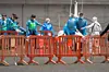 Passengers prepare to board military buses after being transferred from the Dutch flagged hantavirus-stricken cruise ship MV Hondius at the industrial port of Granadilla de Abona on the island of Tenerife in Spain's Canary Islands on May 10, 2026. Repatriation flights for the nearly 150 passengers onboard the ship hit by a deadly hantavirus outbreak began as passengers were transferred to shore on smaller vessels then by bus to the airport to be flown home after weeks at sea. (Photo by JORGE GUERRERO / AFP)